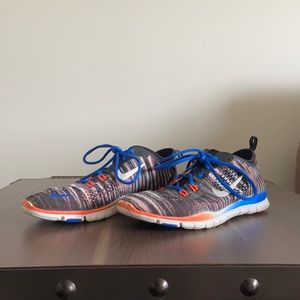 Blue and Orange Nike Multicolored Athletic Shoes.